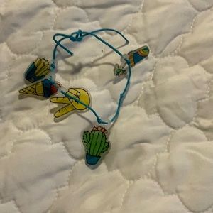 I am selling a blue bracelet with charms on it this bracelet is homemade.